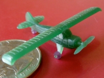Airplane charm with rolling wheels, one-of-a-kind.