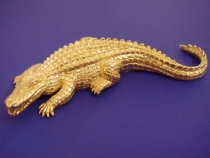 Large gator slide cast in 14kt yellow gold.
